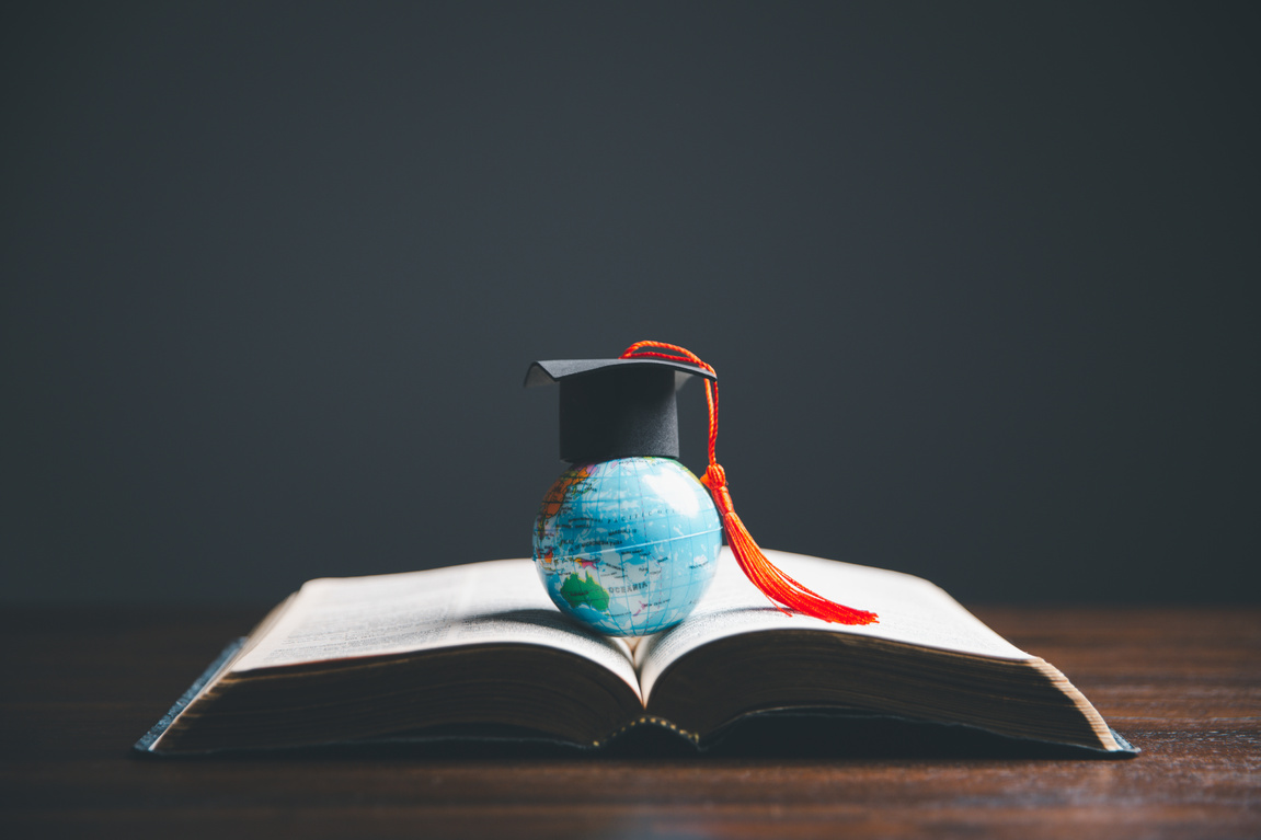 Graduate Studies or Studying KnowledgeLearn Abroad Concept Graduate Open Textbook with Maps Simulating.